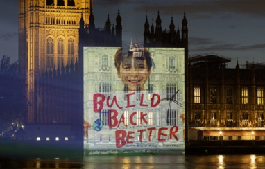Campaigners project their levelling up message onto parliament.