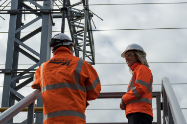 Scottish government transport minister Jenny Gilruth, right, visited the site of the first new feeder station to be commissioned as part of a £120m investment to boost the electricity supply into the railway network. (Image courtesy of Network Rail).