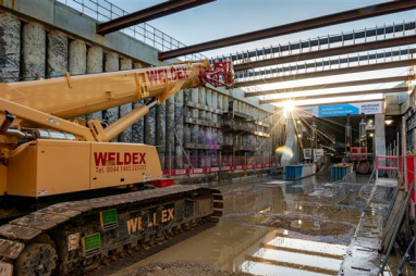 An 11,000 tonne curved concrete box has been pushed under the East Coast Main Line, at Werrington, near Peterborough,in a first for UK engineering.
