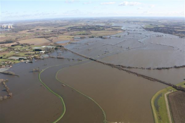 Photo shows extent of previous flooding of railway line near Drax power plant.