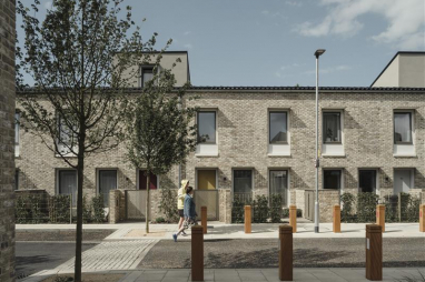 Scape Group calls for ambitious renewal of council housebuilding. Photo shows RIBA Stirling Prize Award-winning council housing in Goldsmith Street, Norwich.