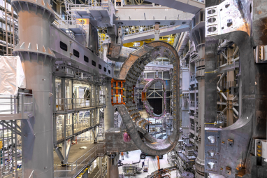 Two 440-tonne vacuum vessel sectors suspended inside the twin sector sub-assembly tools at ITER.