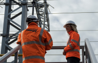 Scottish government transport minister Jenny Gilruth, right, visited the site of the first new feeder station to be commissioned as part of a £120m investment to boost the electricity supply into the railway network. (Image courtesy of Network Rail).