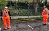 Interserve workers using the SiteZone safety prototypes that help enforce the two-metre rule of social distancing.