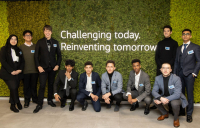 Professor Brian Cox (third from left) with London students at the Jacobs London office opening.