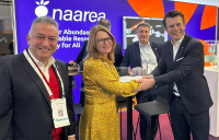Raffaele Muscetta (left) and David Briggs (right), from Naarea, celebrate the signing of the framework contract with Dawn James and Philippe Wolf from Jacobs at the World Nuclear Exhibition in Paris.