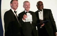 Terry Morgan receives his award from ACE chairman Gavin English (left) and ACE chief executive Nelson Ogunshakin.