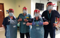 NHS staff in Essex wearing face masks produced on 3D printers by WSP.