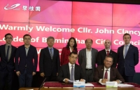 Birmingham Council leader John Clancy (front right) signs an agreement with Country Garden chairman Yang Guoqiang. 